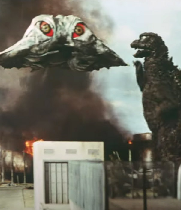 Godzilla watches Hedorah fly past